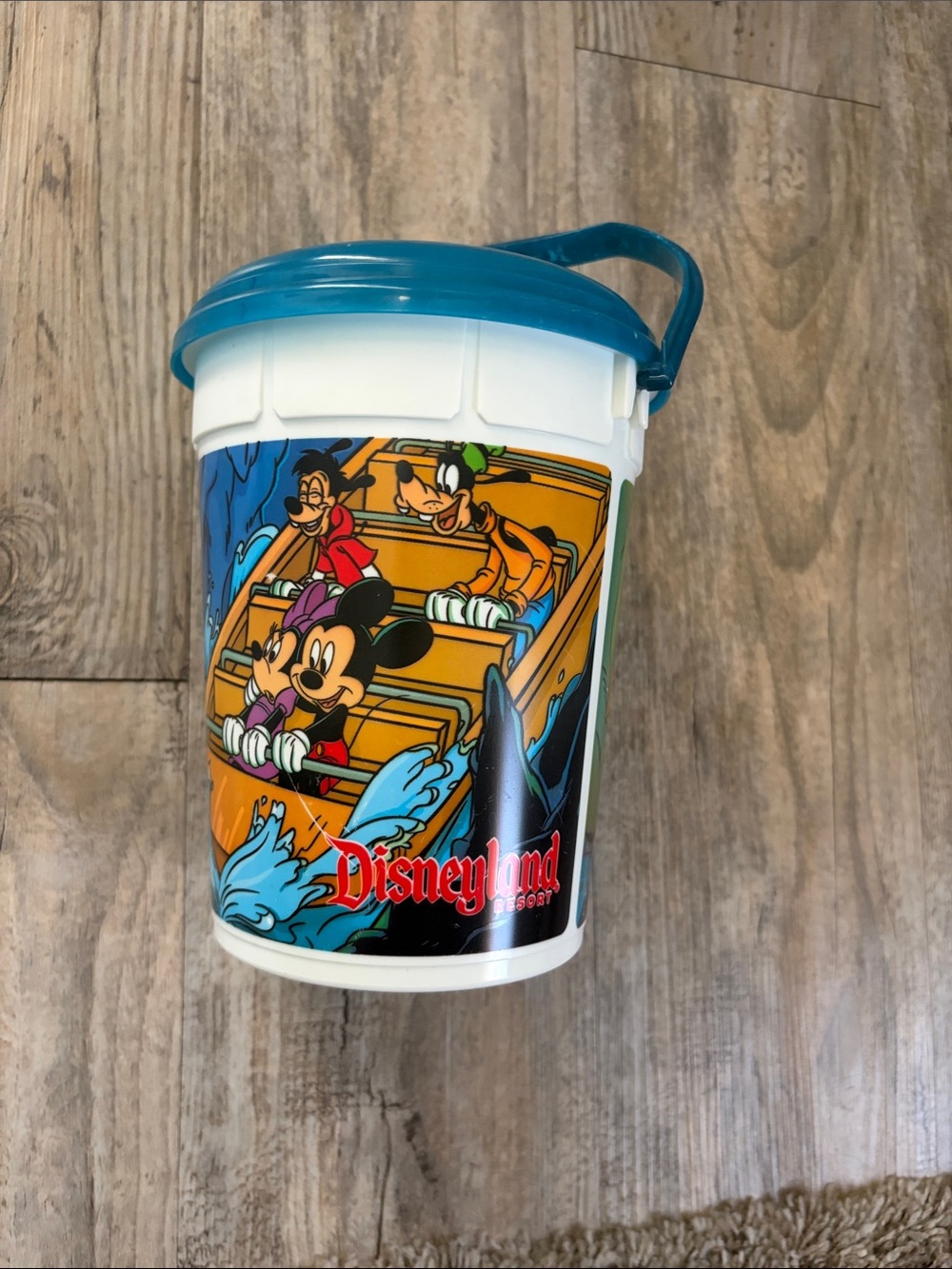 Disney White Reusable Popcorn Collectable Cup with Teal Lid and Handle.